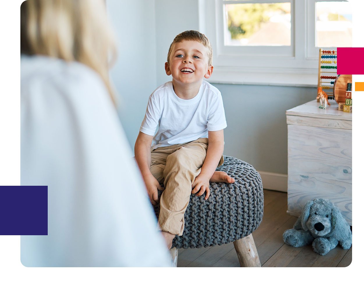 child smiling with psychologist